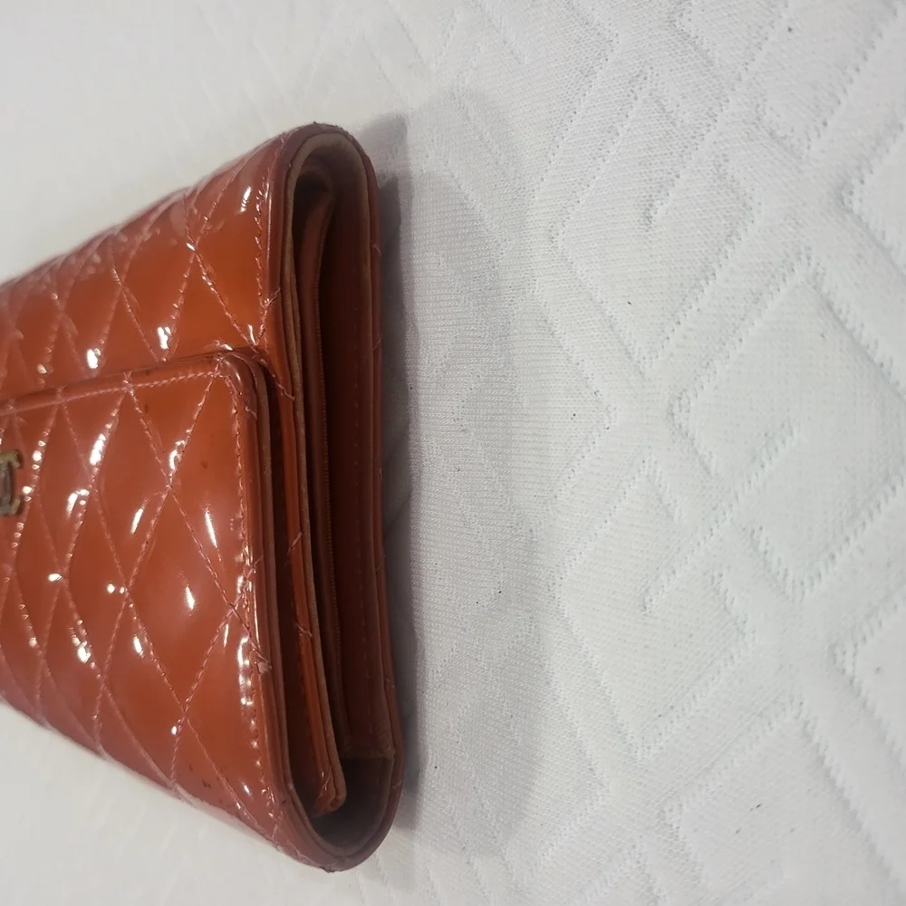 CHANEL Quilted Orange Matelasse Gold CC Logo Patent Leather Long Bifold Wallet.